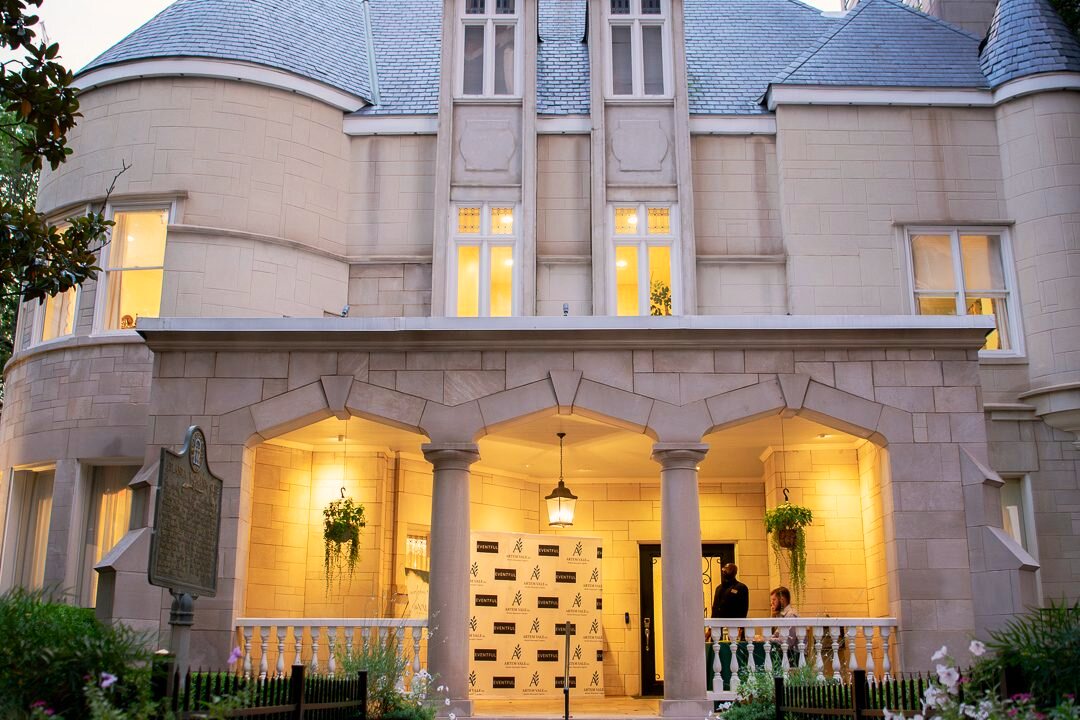 Historic event venue exterior at dusk.