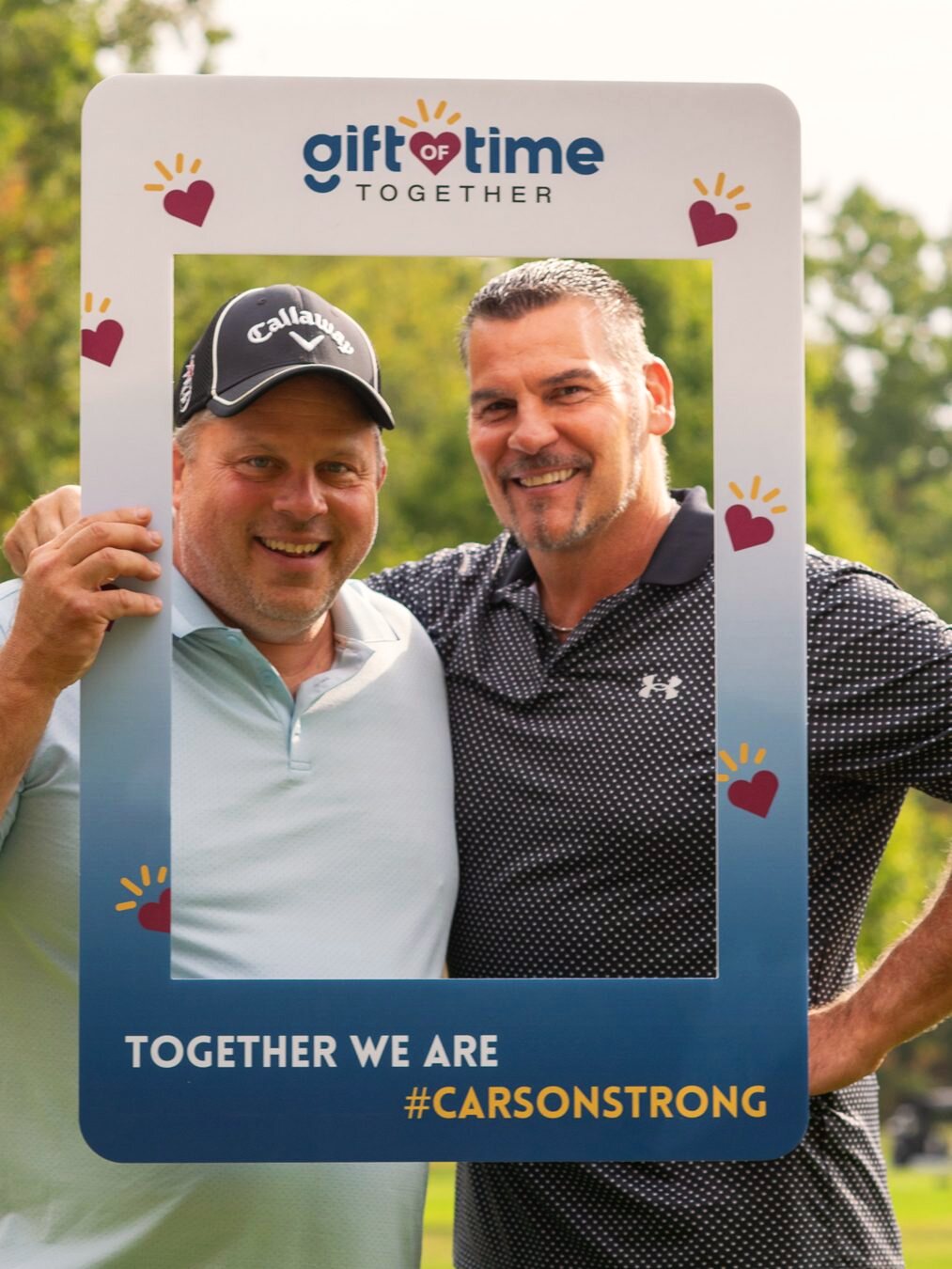 Two attendees posing at a Stewart's Caring Place event.