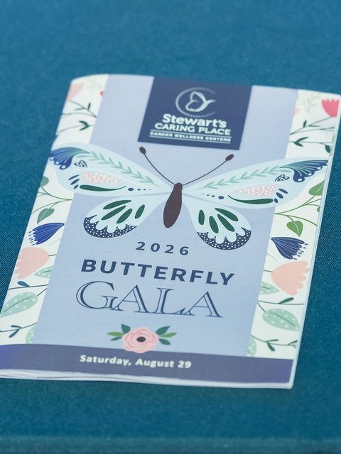 The 2026 Butterfly Gala program on a teal tablecloth, cropped for an Instagram carousel.